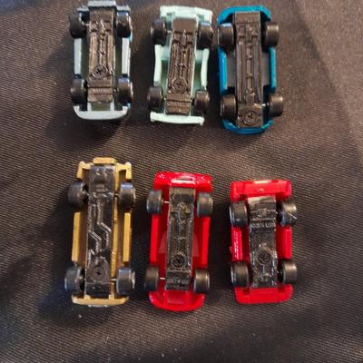 TWELVE MICRO MACHINE CARS  CAR CASE KEYCHAIN AND MICRO CHARGER !