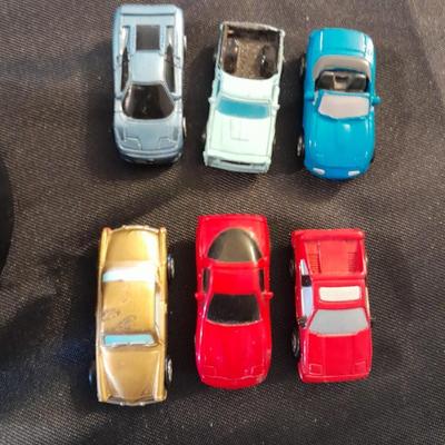 TWELVE MICRO MACHINE CARS  CAR CASE KEYCHAIN AND MICRO CHARGER !