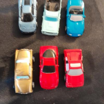TWELVE MICRO MACHINE CARS  CAR CASE KEYCHAIN AND MICRO CHARGER !