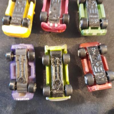 TWELVE MICRO MACHINE CARS  CAR CASE KEYCHAIN AND MICRO CHARGER !