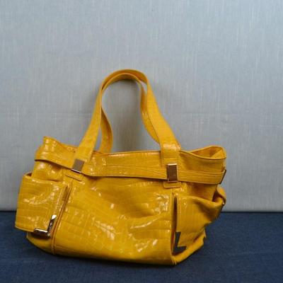 LOT 387. MICHAEL KORS YELLOW PURSE