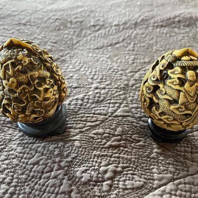 2- egg shaped carved pieces.