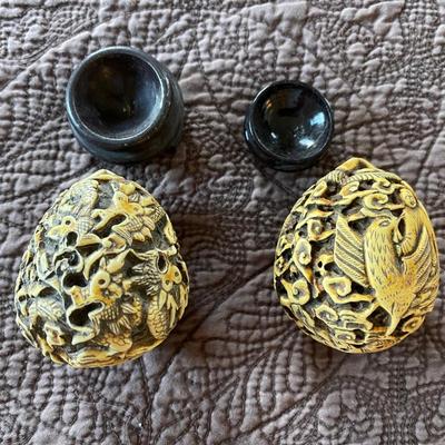 2- egg shaped carved pieces.