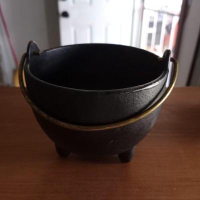TWO CAST IRON POTS