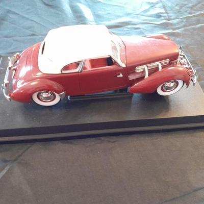 1937 CORD 812 SUPERCHARGED CAR MODEL MOUNTED ON A STAND