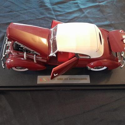 1937 CORD 812 SUPERCHARGED CAR MODEL MOUNTED ON A STAND