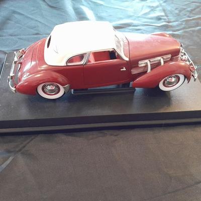 1937 CORD 812 SUPERCHARGED CAR MODEL MOUNTED ON A STAND