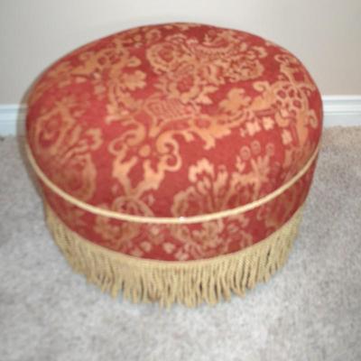 LOT 535. RED AND GOLD ROUND OTTOMAN BY JENNIFER TAYLOR