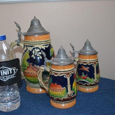 LOT 546. THREE VINTAGE STEINS MADE IN GERMANY