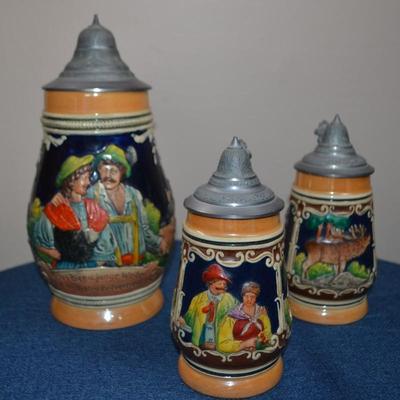 LOT 546. THREE VINTAGE STEINS MADE IN GERMANY