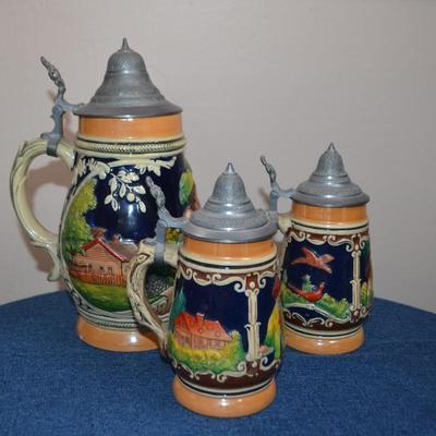 LOT 546. THREE VINTAGE STEINS MADE IN GERMANY