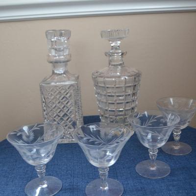 LOT 545 CRYSTAL GLASSES AND TWO DECANTERS
