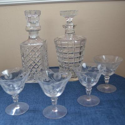 LOT 545 CRYSTAL GLASSES AND TWO DECANTERS