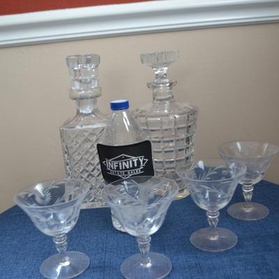 LOT 545 CRYSTAL GLASSES AND TWO DECANTERS