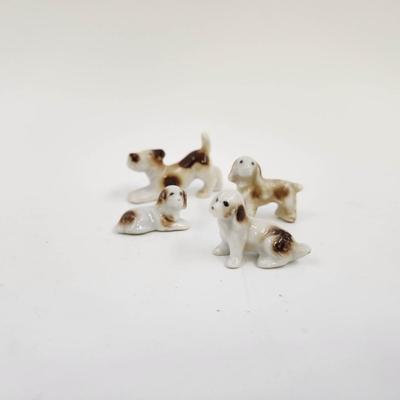 VINTAGE CERAMIC JAPANESE FAMILY OF CUTE DOG FIGURINES