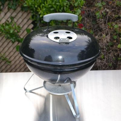 LOT 597. TABLE TOP WEBER GRILL