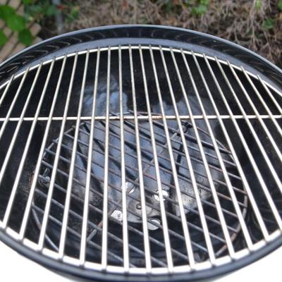 LOT 597. TABLE TOP WEBER GRILL