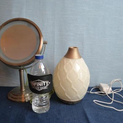 LOT 637. LIGHTED MIRROR AND AROMA  MACHINE