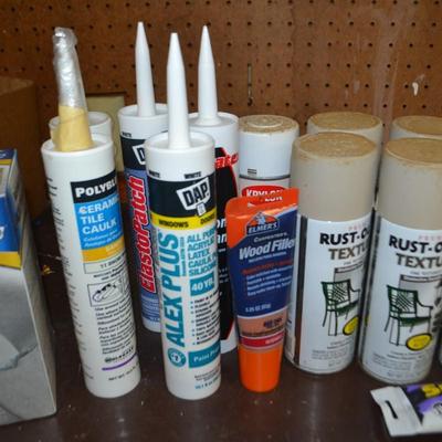 LOT 667 SPRAY PAINT AND LATEX CAULK