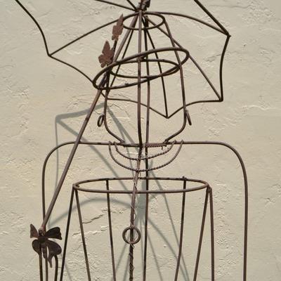 LOT 690. WIRE WOMAN YARD ART WOMAN WITH UMBRELLA