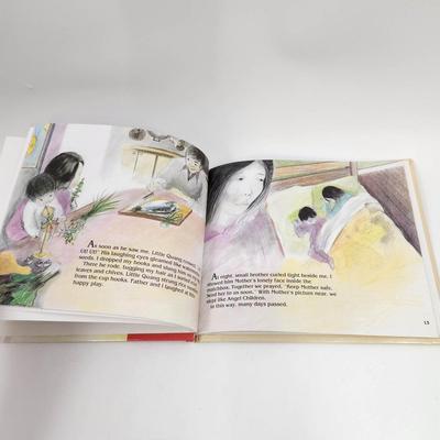 ANGEL CHILD, DRAGON CHILD BY MICHELE MARIA SURAT HARDBACK BOOK