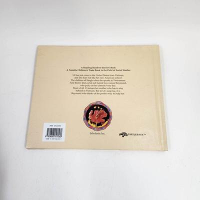 ANGEL CHILD, DRAGON CHILD BY MICHELE MARIA SURAT HARDBACK BOOK