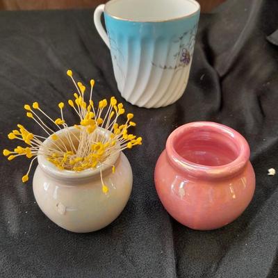 Collection of small porcelain bowls, tea pot, and mug