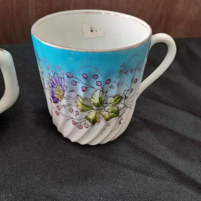 Collection of small porcelain bowls, tea pot, and mug