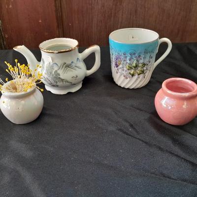Collection of small porcelain bowls, tea pot, and mug