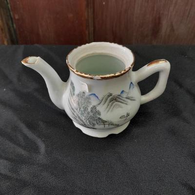 Collection of small porcelain bowls, tea pot, and mug