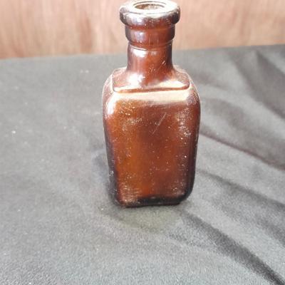 Seven Old glass bottles and jars