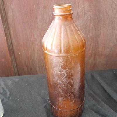 Seven Old glass bottles and jars