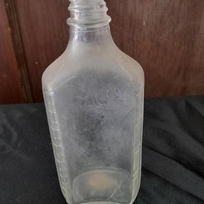 Seven Old glass bottles and jars