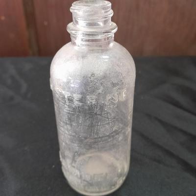 Seven Old glass bottles and jars