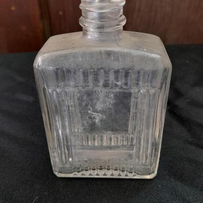 Seven Old glass bottles and jars