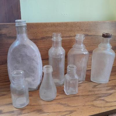 Seven Clear old glass bottles Squire Scuff Kote and others
