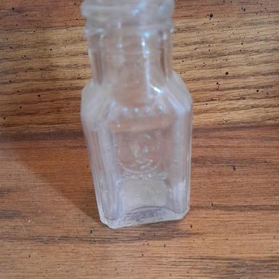 Seven Clear old glass bottles Squire Scuff Kote and others