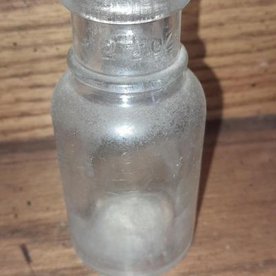 Seven Clear old glass bottles Squire Scuff Kote and others