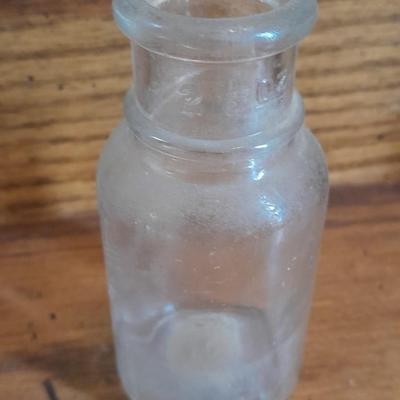 Seven Clear old glass bottles Squire Scuff Kote and others