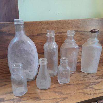 Seven Clear old glass bottles Squire Scuff Kote and others