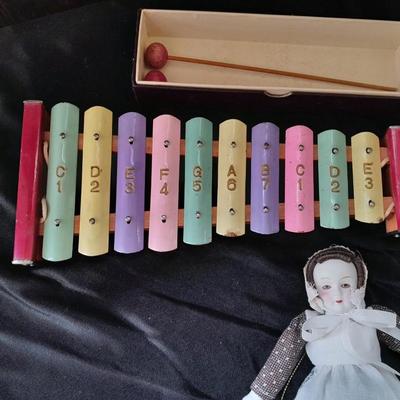 Vintage 10 Key Xylophone with stick, porcelain doll, softball, and Oscar Mayer piggy