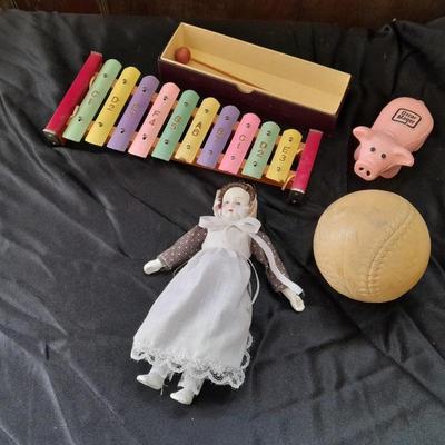 Vintage 10 Key Xylophone with stick, porcelain doll, softball, and Oscar Mayer piggy