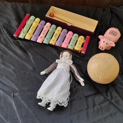 Vintage 10 Key Xylophone with stick, porcelain doll, softball, and Oscar Mayer piggy