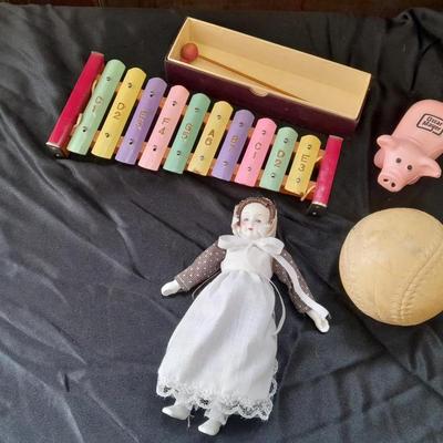 Vintage 10 Key Xylophone with stick, porcelain doll, softball, and Oscar Mayer piggy