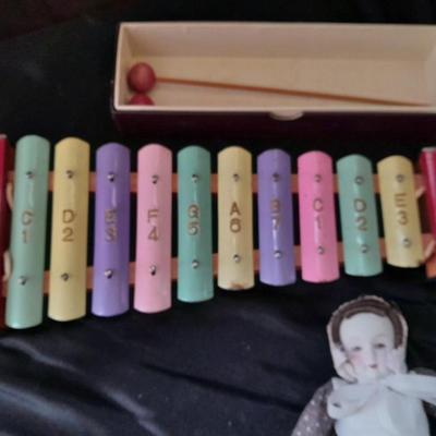 Vintage 10 Key Xylophone with stick, porcelain doll, softball, and Oscar Mayer piggy