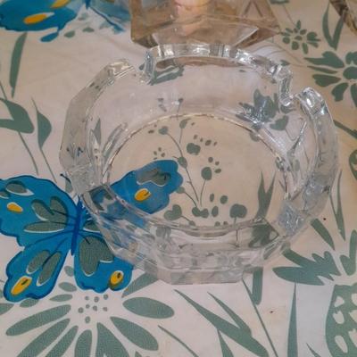 Assorted candles and holders including vintage wooden spool