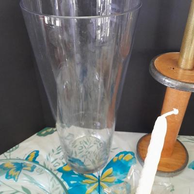 Assorted candles and holders including vintage wooden spool