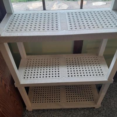Plastic storage shelving with Vintage iron framed chair