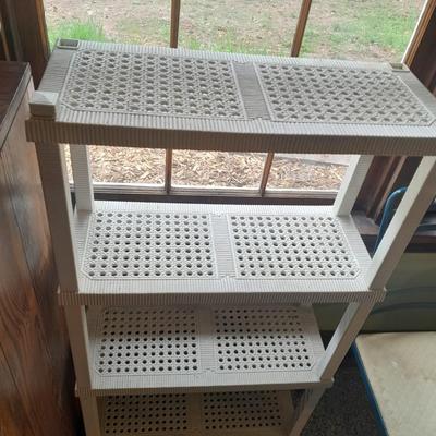 Plastic storage shelving with Vintage iron framed chair