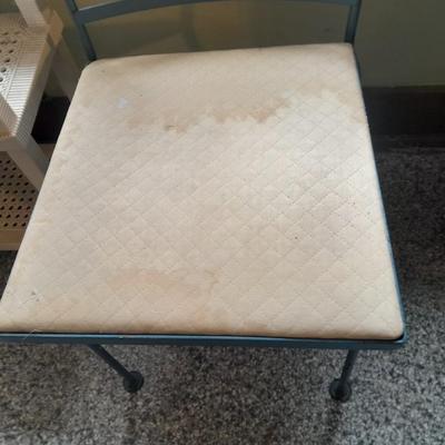 Plastic storage shelving with Vintage iron framed chair